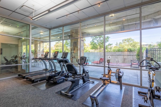 300 E 3rd St Unit 602, Little Rock, AR 72201 - exercise room with floor to ceiling windows and carpet floors