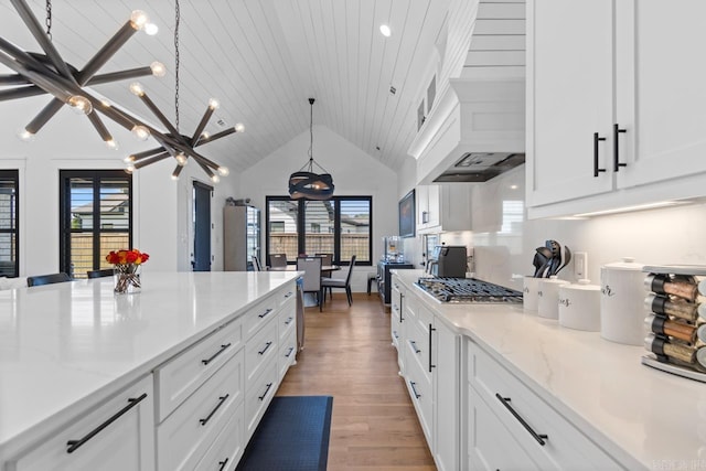 7509 S Shoreline, Benton, AR 72019 - kitchen with stainless steel gas stovetop, light wood-style floors, plenty of natural light, white cabinetry, and recessed lighting