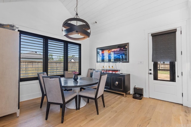 7509 S Shoreline, Benton, AR 72019 - dining area featuring light wood-style floors and lofted ceiling
