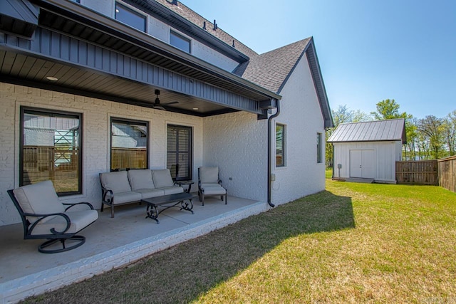 7509 S Shoreline, Benton, AR 72019 - back of house with ceiling fan, a shed, a patio, an outdoor hangout area, and brick siding