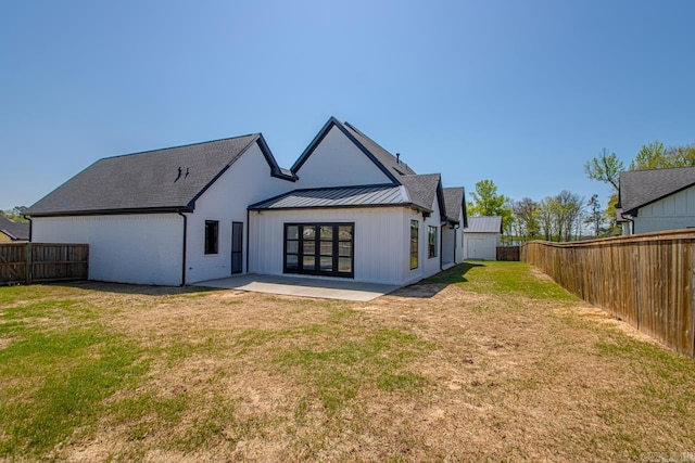 7509 S Shoreline, Benton, AR 72019 - rear view of property with a patio, a fenced backyard, a standing seam roof, and a metal roof