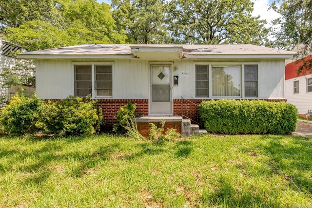 5302 A St, Little Rock, AR 72205 - bungalow-style home with brick siding and a front yard
