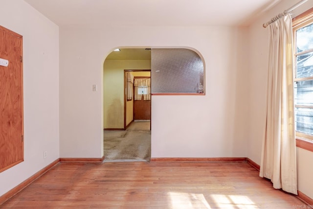 5302 A St, Little Rock, AR 72205 - empty room with arched walkways and wood finished floors