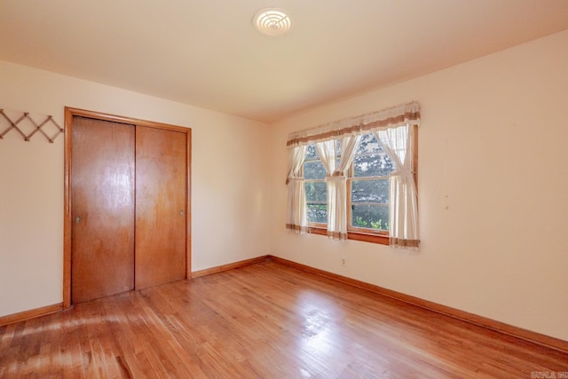 5302 A St, Little Rock, AR 72205 - unfurnished bedroom with light wood-style flooring and a closet