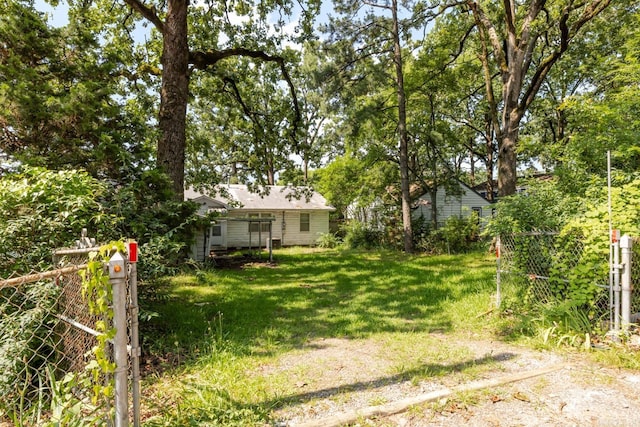 5302 A St, Little Rock, AR 72205 - view of yard featuring a gate and an outbuilding
