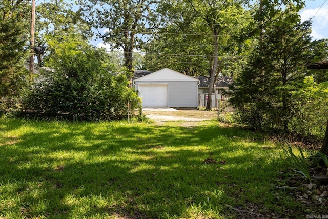 5302 A St, Little Rock, AR 72205 - view of green lawn with a garage and an outbuilding