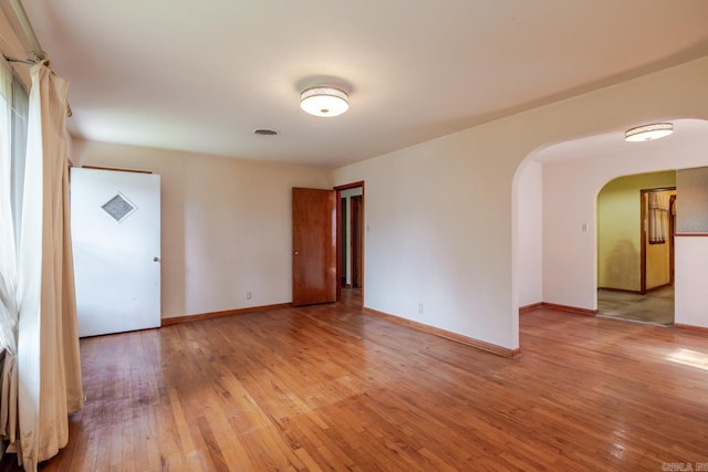 5302 A St, Little Rock, AR 72205 - spare room featuring light wood finished floors and arched walkways