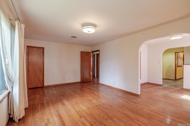 5302 A St, Little Rock, AR 72205 - spare room with light wood-type flooring and arched walkways