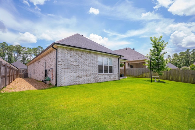 112 Rosemary Way, Little Rock, AR 72223 - rear view of house with a fenced backyard, brick siding, and a shingled roof