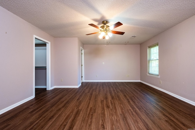 304 Dogwood Dr, Benton, AR 72019 - unfurnished room with dark wood-style floors, ceiling fan, and a textured ceiling
