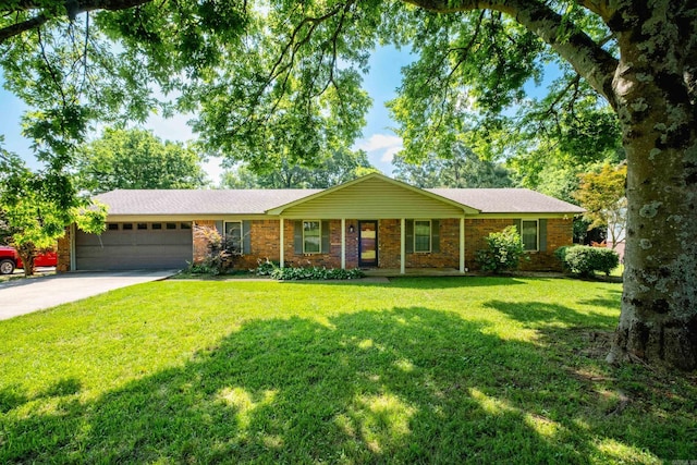 304 Dogwood Dr, Benton, AR 72019 - ranch-style home with a garage, driveway, a front lawn, and brick siding