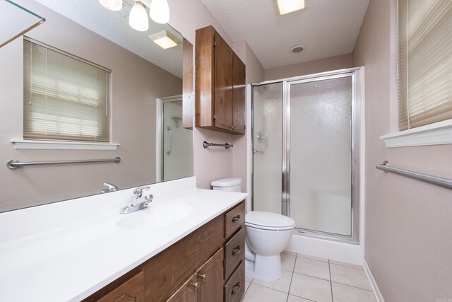 304 Dogwood Dr, Benton, AR 72019 - bathroom with vanity, a stall shower, tile patterned floors, and a textured ceiling