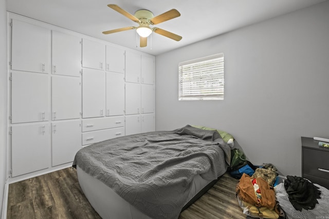 1324 Sunset Dr, Conway, AR 72034 - bedroom with dark wood-style floors and ceiling fan