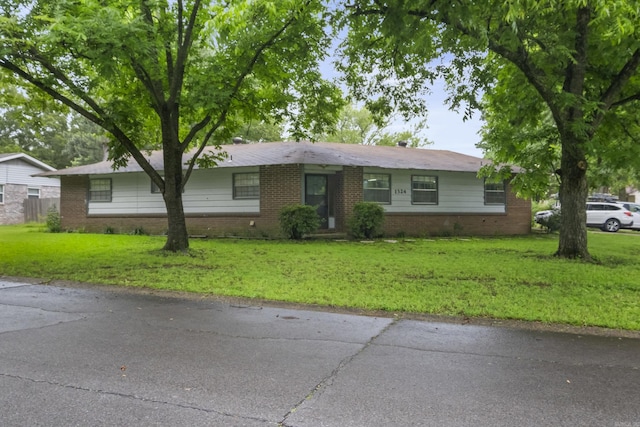 1324 Sunset Dr, Conway, AR 72034 - single story home with brick siding and a front lawn