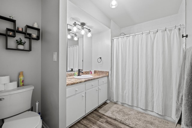 1324 Sunset Dr, Conway, AR 72034 - full bathroom with vanity, wood finished floors, and curtained shower