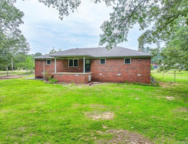 427 Morrison, Arkadelphia, AR 71923 - rear view of property with a yard, brick siding, and crawl space