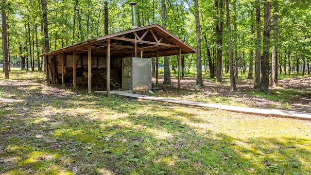 424 Center Rdg, Drasco, AR 72543 - view of community with an outbuilding and a forest view