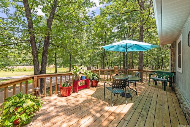 424 Center Rdg, Drasco, AR 72543 - deck featuring outdoor dining area and view of scattered trees