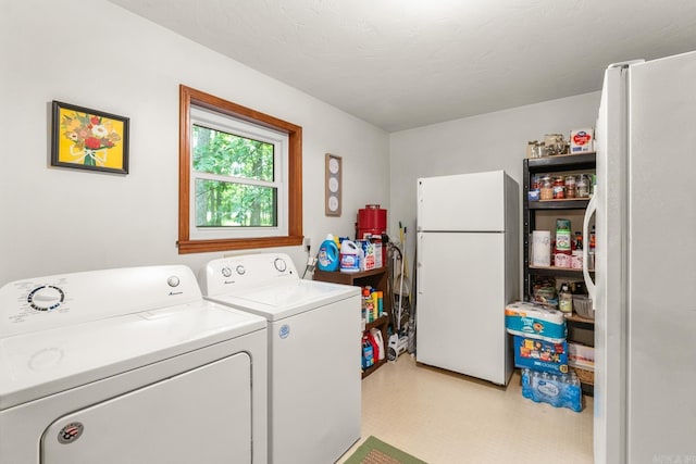 424 Center Rdg, Drasco, AR 72543 - washroom with washing machine and dryer and light flooring