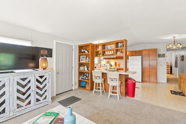 424 Center Rdg, Drasco, AR 72543 - living area featuring vaulted ceiling, a chandelier, light colored carpet, and a textured ceiling
