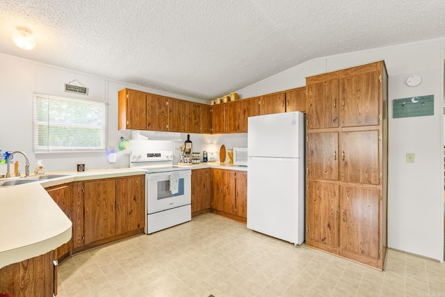 424 Center Rdg, Drasco, AR 72543 - kitchen with white appliances, under cabinet range hood, brown cabinetry, light flooring, and a textured ceiling