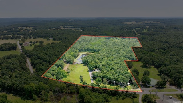 424 Center Rdg, Drasco, AR 72543 - aerial view of property and surrounding area with a heavily wooded area and property parcel outlined