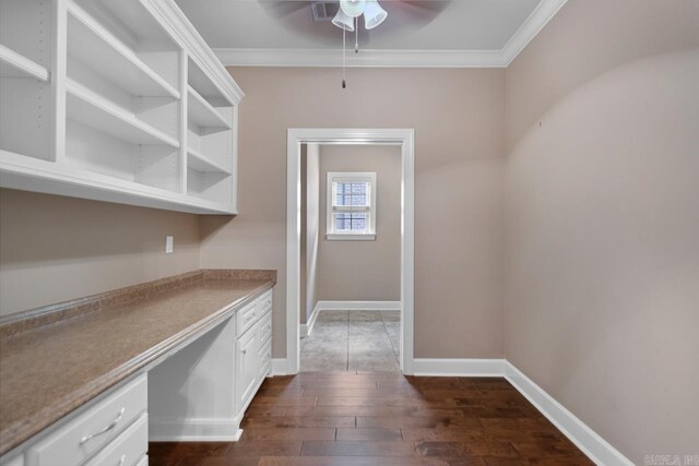 9 Bishop Pl, Little Rock, AR 72223 - kitchen with a ceiling fan, dark wood-style flooring, ornamental molding, built in desk, and white cabinets