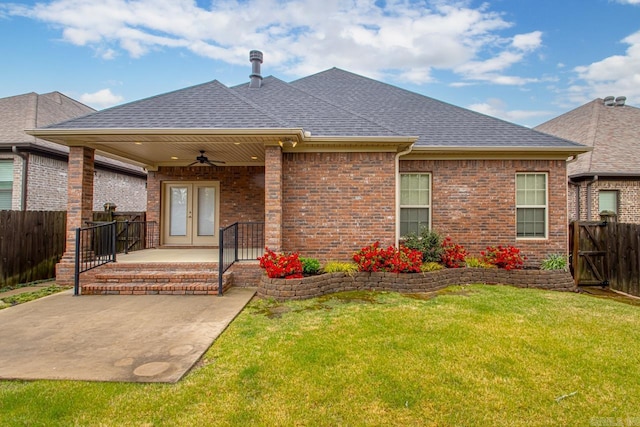 9 Bishop Pl, Little Rock, AR 72223 - rear view of property featuring ceiling fan, roof with shingles, a fenced backyard, brick siding, and french doors