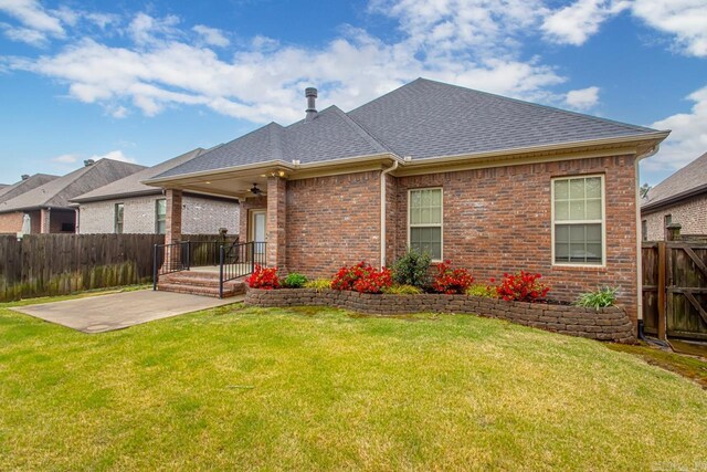 9 Bishop Pl, Little Rock, AR 72223 - back of property with a patio area, a shingled roof, ceiling fan, a fenced backyard, and brick siding