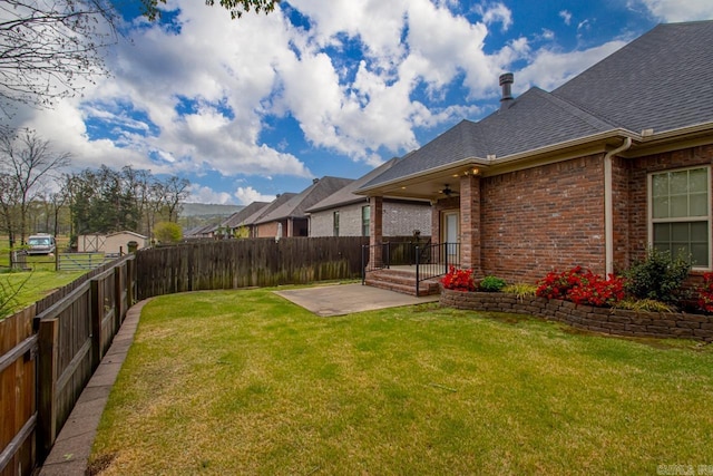 9 Bishop Pl, Little Rock, AR 72223 - fenced backyard with a ceiling fan and a patio area