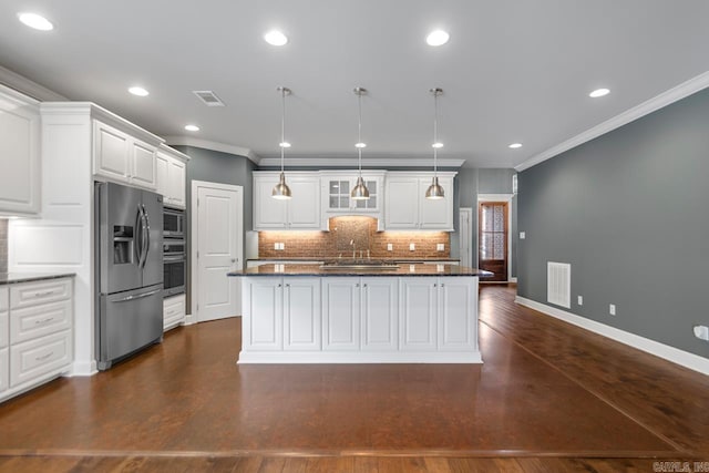 9 Bishop Pl, Little Rock, AR 72223 - kitchen featuring stainless steel appliances, crown molding, backsplash, white cabinetry, and a center island