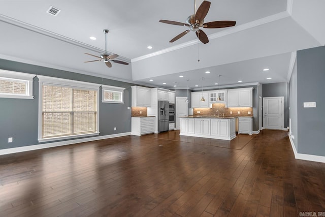 9 Bishop Pl, Little Rock, AR 72223 - unfurnished living room with ceiling fan, ornamental molding, dark wood-style floors, and recessed lighting