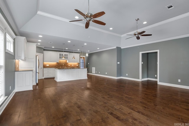 9 Bishop Pl, Little Rock, AR 72223 - unfurnished living room with ceiling fan, recessed lighting, dark wood-style floors, and ornamental molding