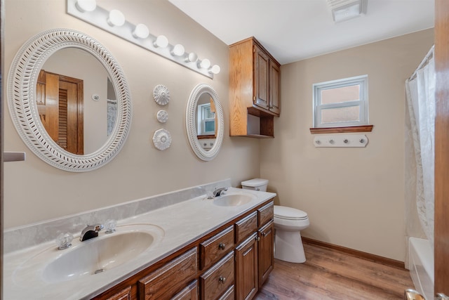 4202 Stoneview Ct, Little Rock, AR 72212 - bathroom featuring double vanity, wood finished floors, and shower / tub combo