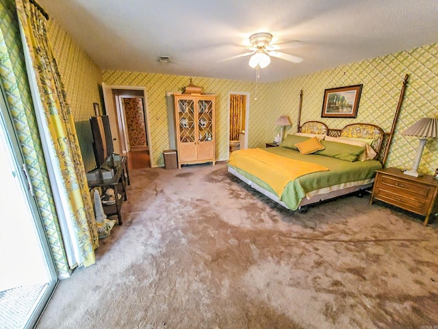 1127 Twin Points Rd Unit A, Hot Springs, AR 71913 - carpeted bedroom featuring wallpapered walls, a ceiling fan, and a wood stove