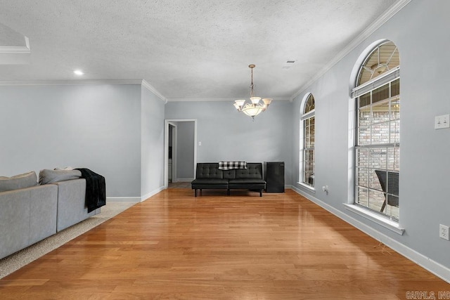 31 Auburn Hills Dr, Greenbrier, AR 72058 - dining area with ornamental molding, a chandelier, light wood finished floors, a textured ceiling, and recessed lighting