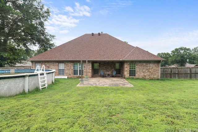 31 Auburn Hills Dr, Greenbrier, AR 72058 - rear view of property featuring a patio area, a shingled roof, and brick siding