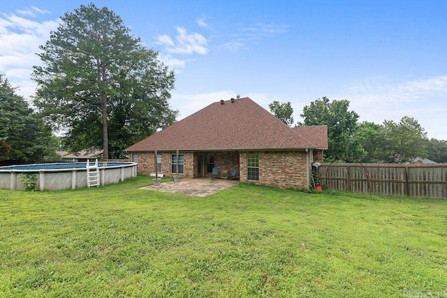 31 Auburn Hills Dr, Greenbrier, AR 72058 - rear view of house featuring a patio, a shingled roof, and brick siding