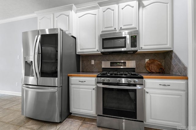 31 Auburn Hills Dr, Greenbrier, AR 72058 - kitchen featuring appliances with stainless steel finishes, decorative backsplash, white cabinetry, and crown molding