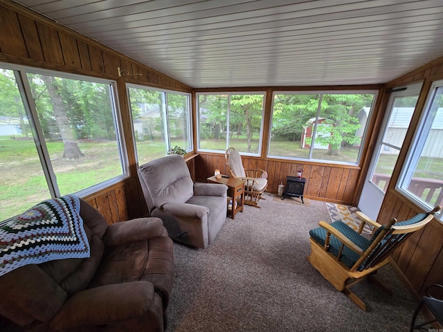 1206 Broadway Ave, Bull Shoals, AR 72619 - sunroom with wood walls, vaulted ceiling, and carpet
