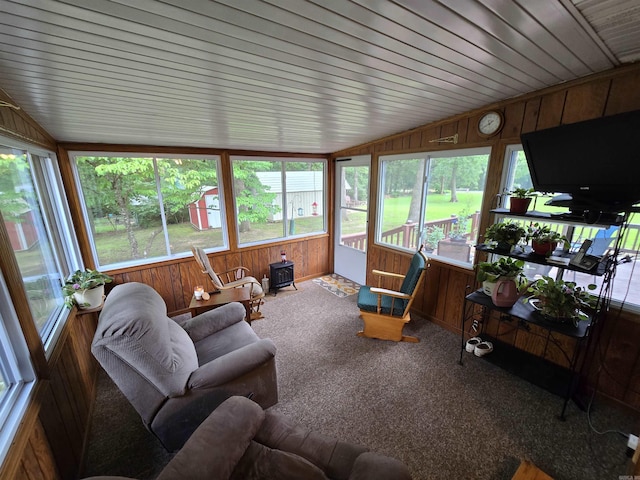 1206 Broadway Ave, Bull Shoals, AR 72619 - sunroom with vaulted ceiling, wood walls, carpet, and healthy amount of natural light