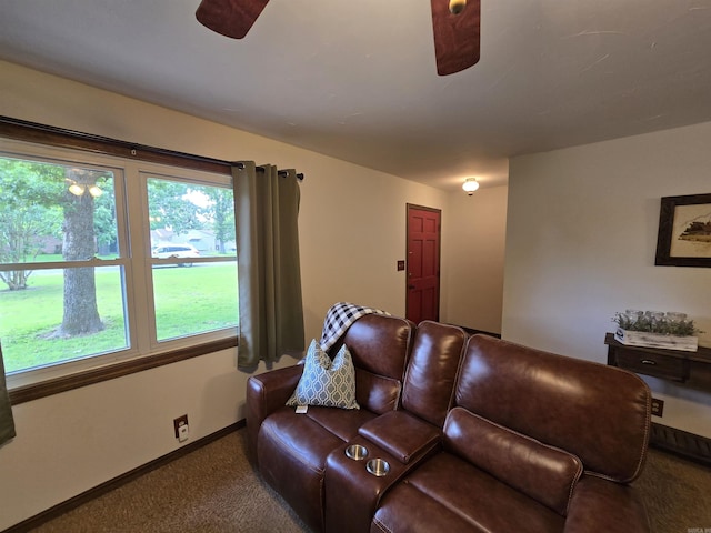 1206 Broadway Ave, Bull Shoals, AR 72619 - carpeted living area featuring a ceiling fan and baseboards