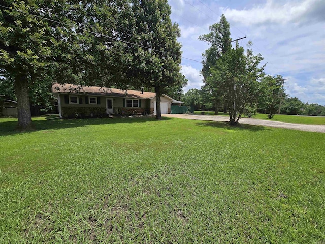 1206 Broadway Ave, Bull Shoals, AR 72619 - ranch-style home with concrete driveway, a front lawn, and a garage
