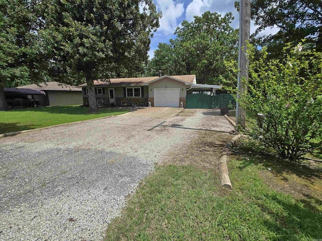 1206 Broadway Ave, Bull Shoals, AR 72619 - ranch-style home with driveway, a garage, a carport, and stone siding