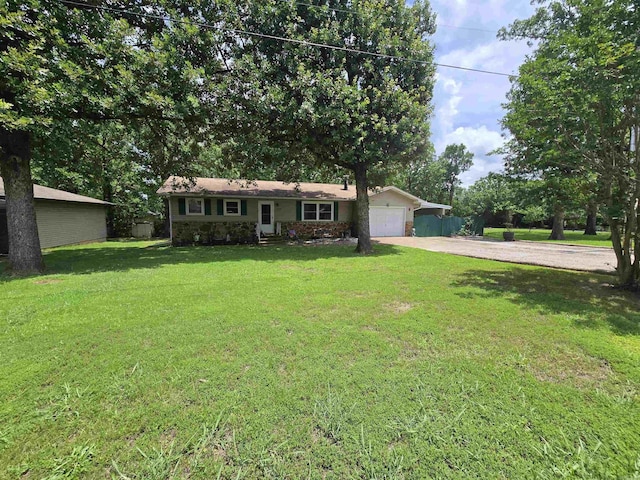 1206 Broadway Ave, Bull Shoals, AR 72619 - single story home with concrete driveway, an attached garage, a front lawn, and stone siding