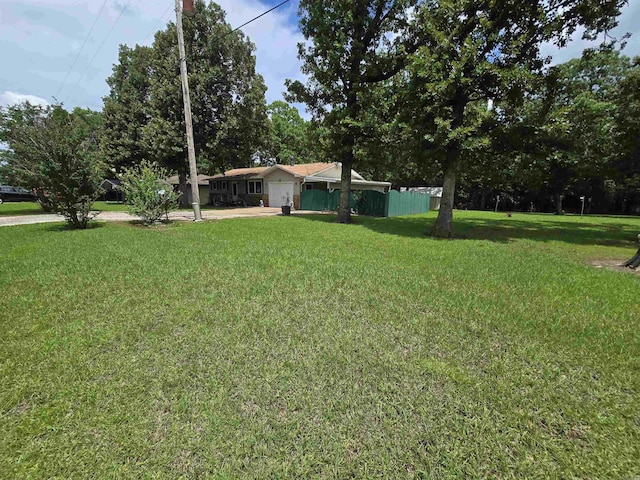 1206 Broadway Ave, Bull Shoals, AR 72619 - view of yard with concrete driveway and an attached garage