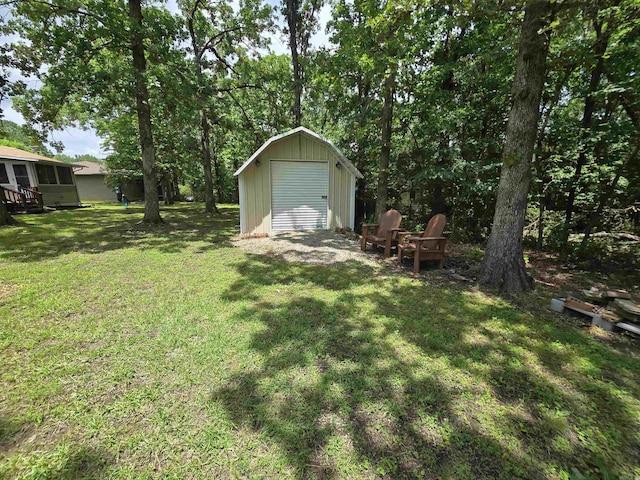 1206 Broadway Ave, Bull Shoals, AR 72619 - view of green lawn featuring a storage shed