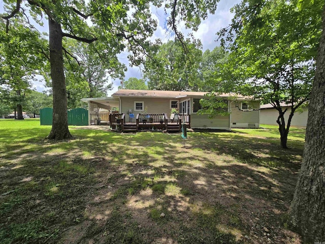 1206 Broadway Ave, Bull Shoals, AR 72619 - rear view of house with a deck and a lawn