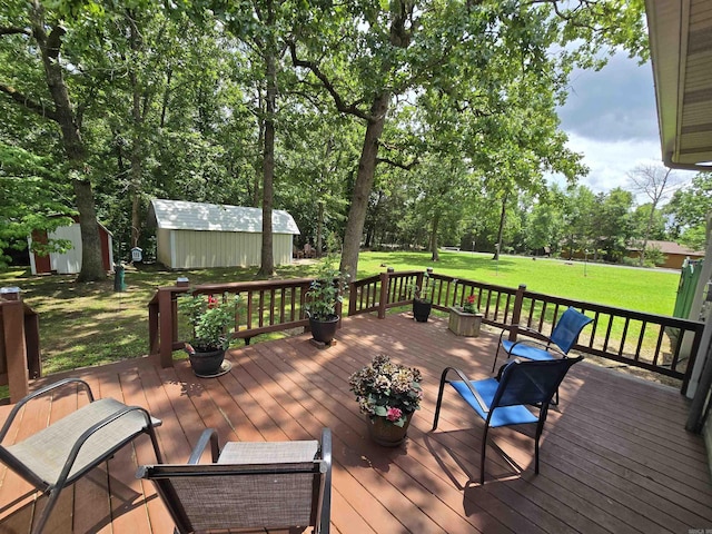 1206 Broadway Ave, Bull Shoals, AR 72619 - wooden terrace featuring a storage shed, a lawn, and view of scattered trees