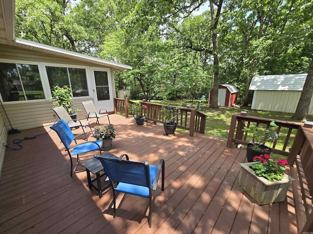 1206 Broadway Ave, Bull Shoals, AR 72619 - wooden deck featuring a storage shed and view of wooded area